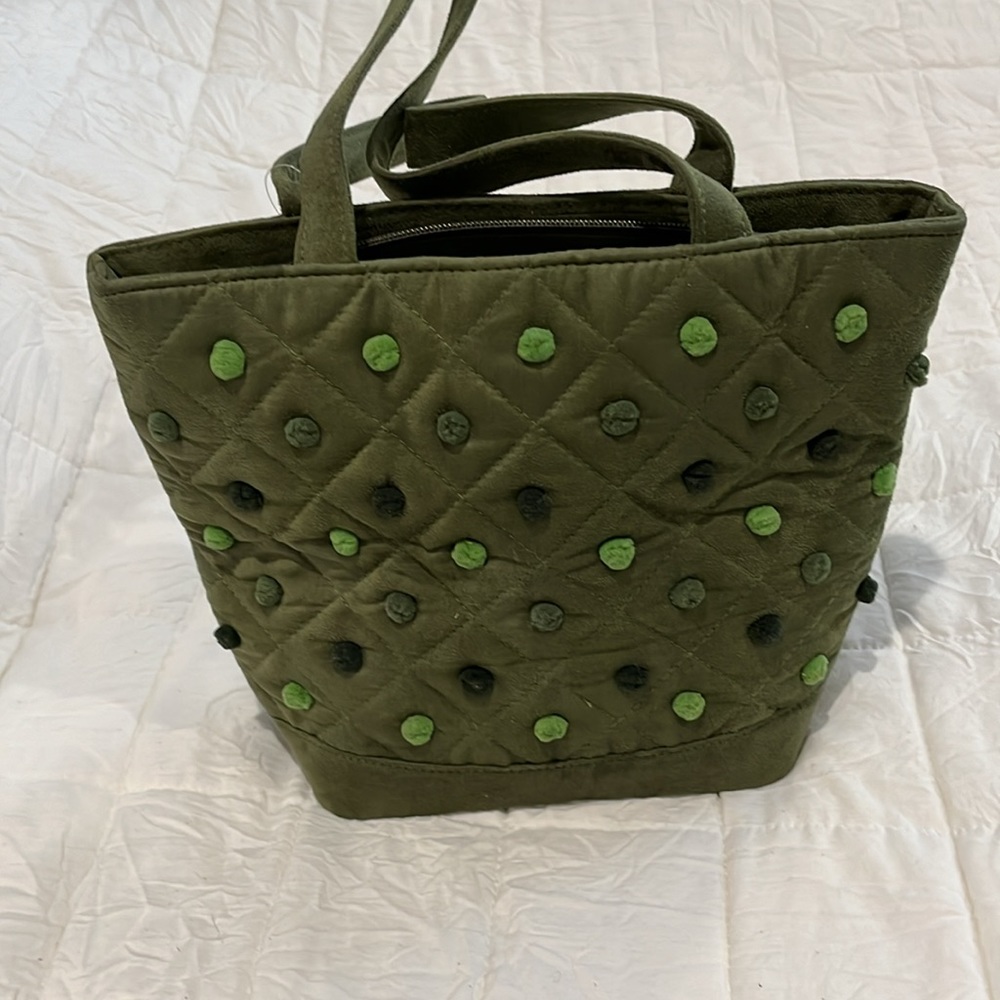 Army Green Handbag. Has Pom Pom on front. Faux suede with 2 straps.